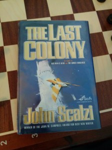 The Last Colony by John Scalzi, hardcover, on a chess board