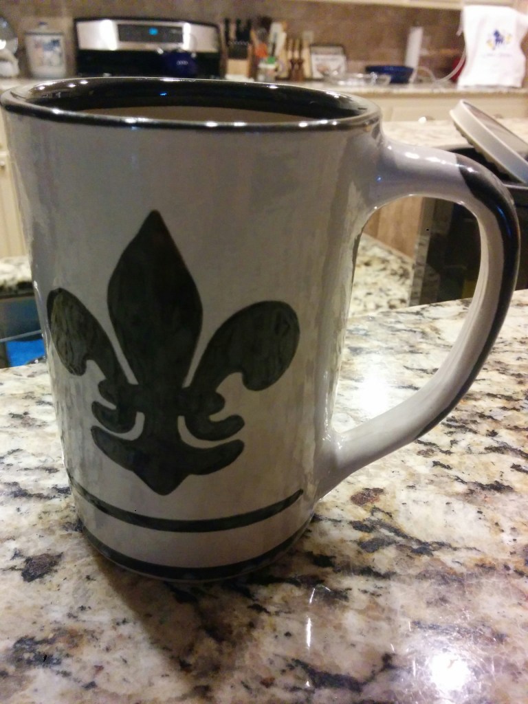 A coffee mug made by Louisville Stoneware